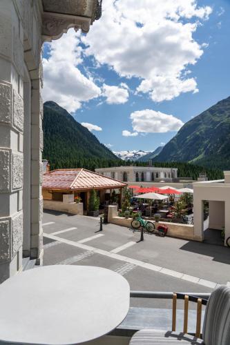 a view from the balcony of a resort with mountains at Sporthotel Pontresina in Pontresina