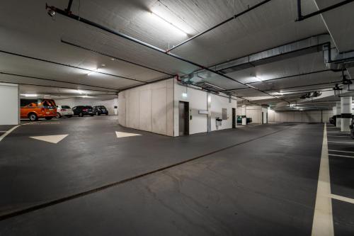 an empty parking garage with cars parked in it at Sporthotel Pontresina in Pontresina