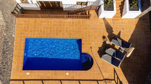 an overhead view of a swimming pool on a tile floor at Villa DaVinci - Playa Blanca in Playa Blanca