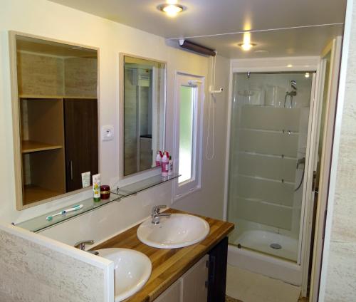 a bathroom with a sink and a shower at Camping de la Treille in Cavalaire-sur-Mer