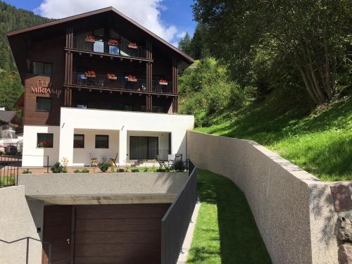 a house on the side of a hill at Chalet Miriam in Selva di Val Gardena