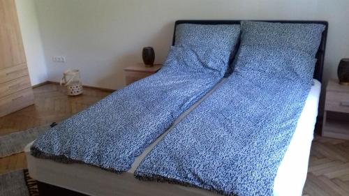 Postel nebo postele na pokoji v ubytování JG Apartman