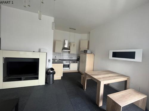 a small kitchen with a table and a table sidx sidx sidx sidx at Apartment in Solingen Ohligs in Solingen