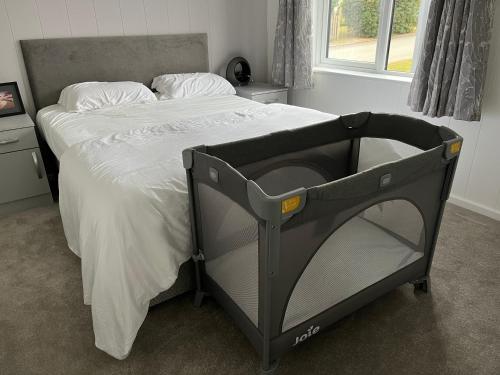 a hospital bed in a bedroom with a bed frame at Beach Base Lodge, Padstow Cornwall in Padstow