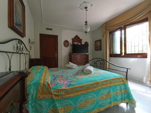 a bedroom with a bed with two stuffed animals on it at Domus Garden in Olbia