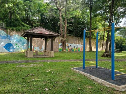 a playground with a gazebo in a park at Sakura Home in Batu Ferringhi