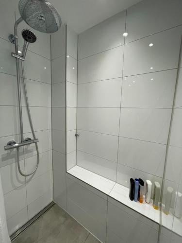 a bathroom with a shower with a glass door at Haus am Seerhein in Konstanz