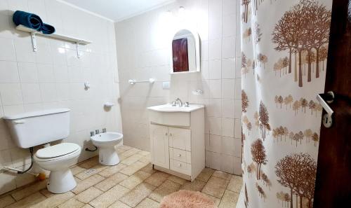a bathroom with a toilet and a sink at Hermosa casa PH equipada y con patio. Aestrenar in Mar del Plata