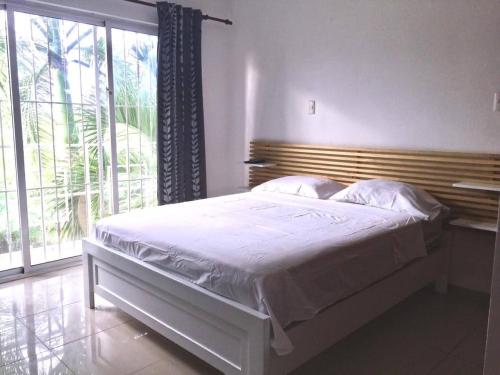 Postel nebo postele na pokoji v ubytování Blue Garden Apartment Punta Cana