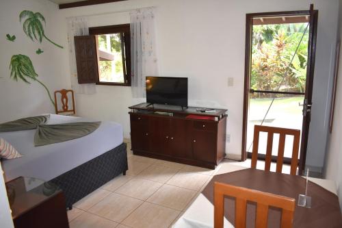 Μια τηλεόραση ή/και κέντρο ψυχαγωγίας στο Hotel Pousada Rancho Fundo