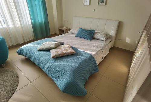 a bedroom with a bed with two pillows on it at Cuvi Studio S in Rovinj