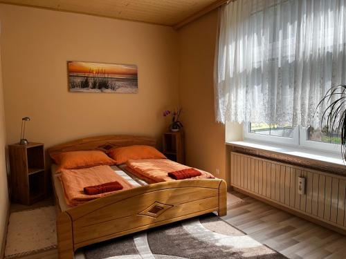 a bedroom with a bed and a window at Palma Apartment in Schottwien