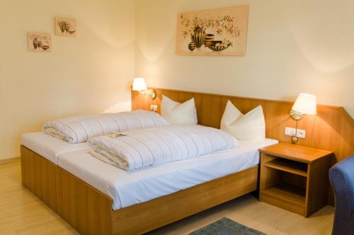 En eller flere senge i et værelse på Akzent Hotel Zur Grünen Eiche