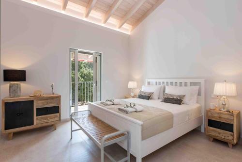 Ένα ή περισσότερα κρεβάτια σε δωμάτιο στο Villa Helonaki
