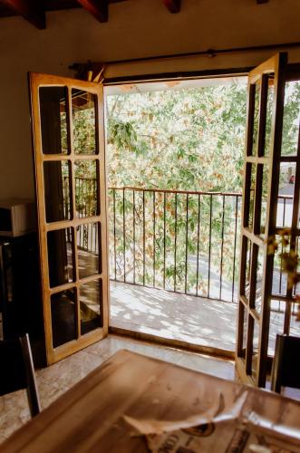 an open door with a view of a balcony at Hakuna Matata in Malargüe