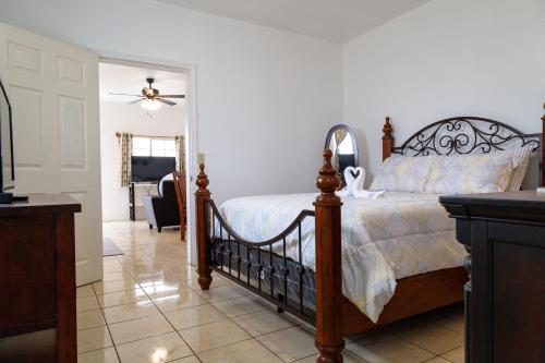 a bedroom with a bed and a dining room at Seaside Adventure Lodging in Ensenada
