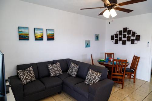 a living room with a couch and a table at Seaside Adventure Lodging in Ensenada