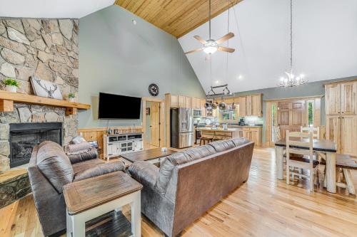 a living room with a couch and a fireplace at Deer Run Retreat in Ellijay
