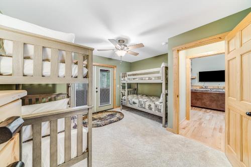 a room with two bunk beds and a tv at Deer Run Retreat in Ellijay