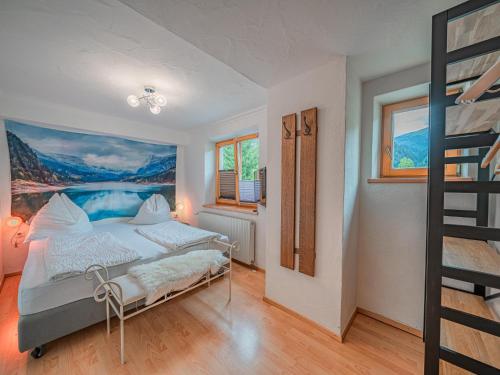 een slaapkamer met een bed met een schilderij aan de muur bij Haus Bernadette in Bramberg am Wildkogel