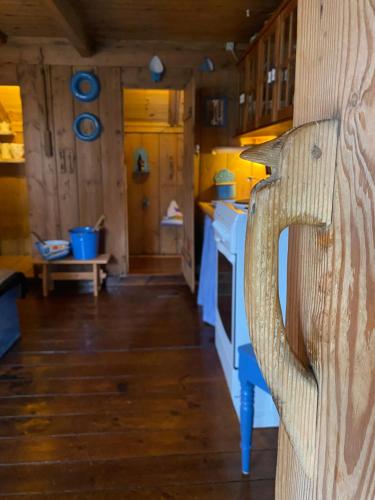 a kitchen with a blue and white stove at Charming and Authentic Heritage Retreat in Kvívík - right next to the river in Kvívík