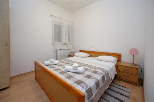 Posteľ alebo postele v izbe v ubytovaní Apartment Sukosan 16641c