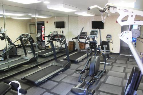 a gym with several treadms and cardio machines at Country Inn & Suites by Radisson, Lackland AFB San Antonio, TX in San Antonio