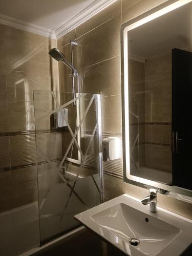 a bathroom with a sink and a mirror at Sheraton ocean 603 - Without Pool access in Cairo