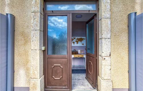 a wooden door in a brick building at 3 Bedroom Stunning Home In Baraqueville in Baraqueville