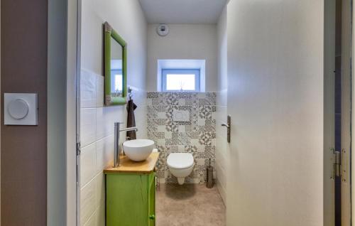 a bathroom with a sink and a toilet in it at 3 Bedroom Stunning Home In Baraqueville in Baraqueville