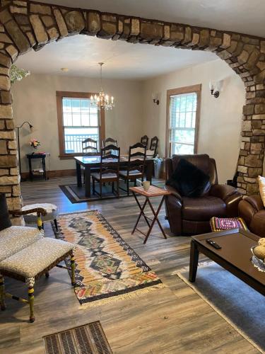 a living room with a couch and a table at Sherman Hill Des Moines in Des Moines