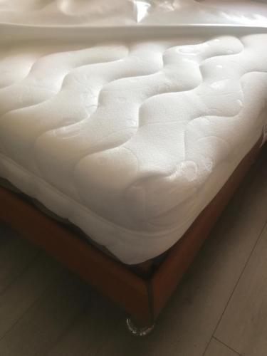 Gîte de Jean-Benoitにあるベッド