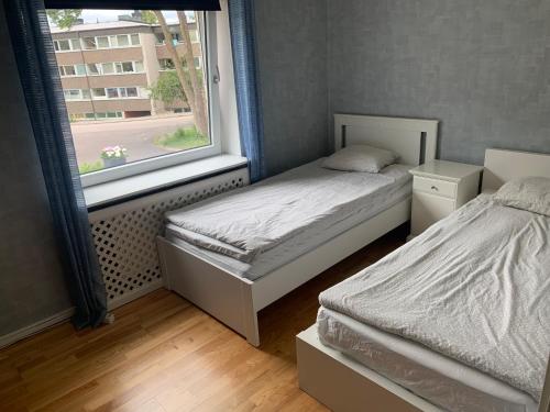 Postel nebo postele na pokoji v ubytování Child friendly Villa 4BR 10 min to Gothenburg City