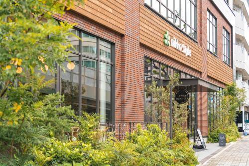 a store front of a brick building at Nikko Style Nagoya in Nagoya