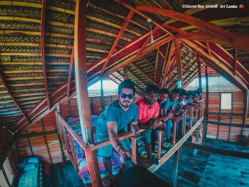 a group of people standing on a train at Secret Bay Panama in Arugam Bay
