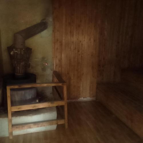 a room with a wood paneled wall and a machine at Dream jet suites in Entebbe