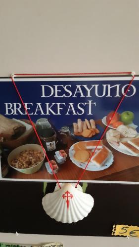 a sign for a dessert breakfast with a picture of food at Alfonso XII in Redondela