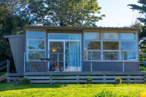 a tiny house with a large window at Harmony at Tower Hill in Koroit