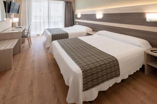 Кровать или кровати в номере 4R Playa Park