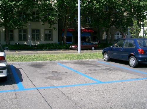 a blue car parked in a parking lot at Pearl Guest House Vanderbijlpark Johannesburg in Vanderbijlpark