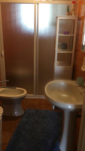 a bathroom with a sink and a toilet at a casa di Manu in Torre dell'Orso