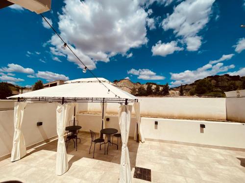 a gazebo on the roof of a house at Il Casale dei Calanchi in Aliano