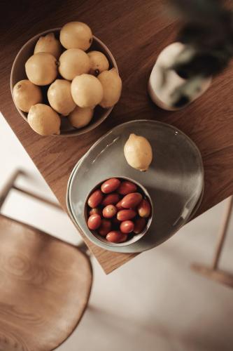 a bowl of beans and a bowl of potatoes on a table at Om Living Afitos in Afitos