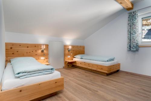 Postel nebo postele na pokoji v ubytování Apartments Samberg