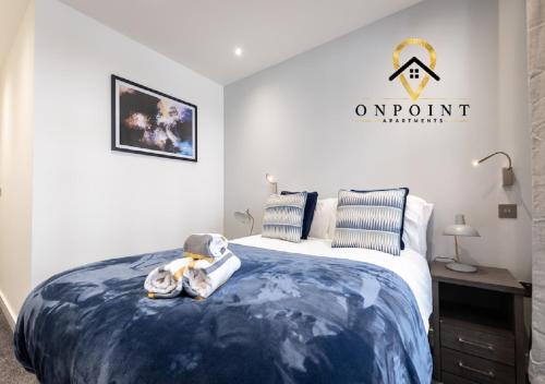 a bedroom with a bed with a teddy bear sitting on it at ✰OnPoint - Fantastic 1 Bedroom Apt with PARKING✰ in Reading