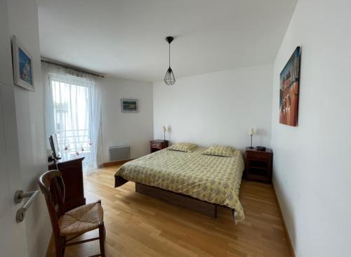 Ένα ή περισσότερα κρεβάτια σε δωμάτιο στο Appartement Le Rev