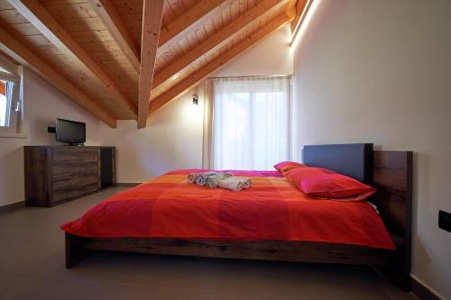 Posteľ alebo postele v izbe v ubytovaní La Casa Rossa