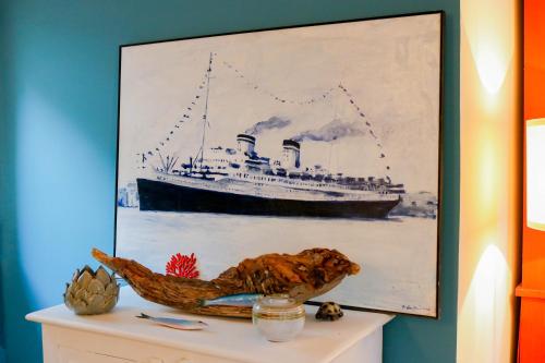 a painting of a ship on a table at H11 COUNTRY LUX - Sanremo - Garden in Sanremo