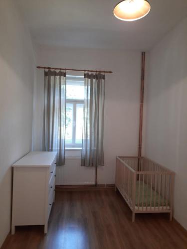Кровать или кровати в номере Apartmány Janská