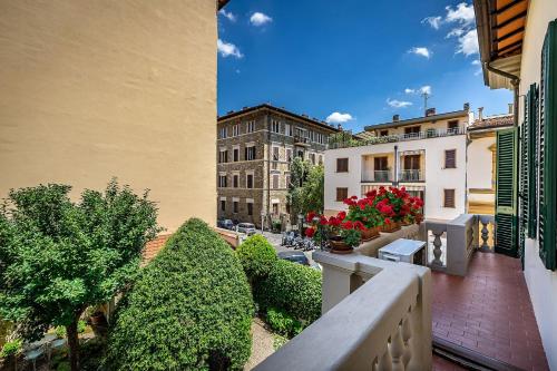 a view of a city from a balcony with flowers at A Casa di Lilli in Florence